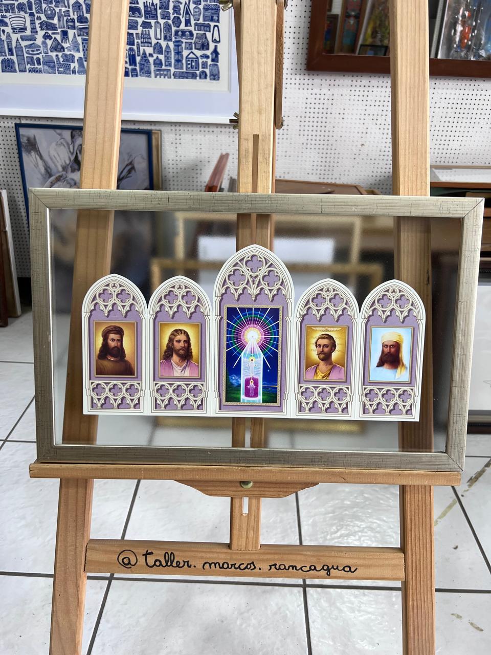 Lámina religiosa con imágenes de Cristo y santos enmarcada